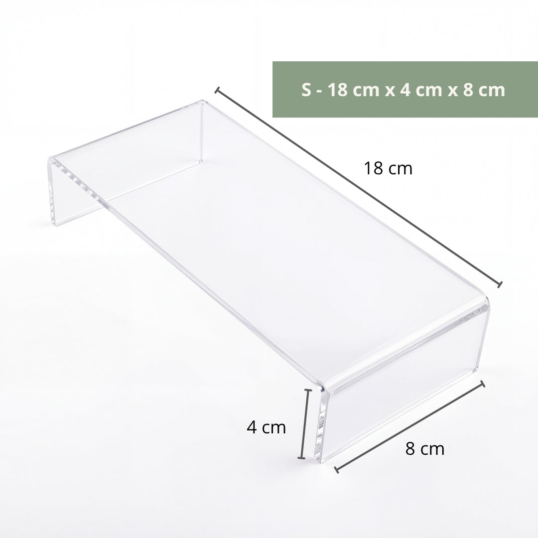 Clear acrylic riser in office display showing award or plaque