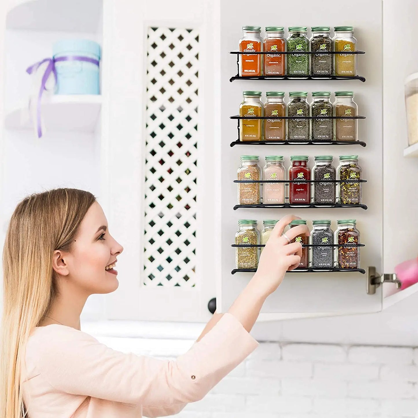 Matte black wall spice rack in modern minimalist kitchen setting